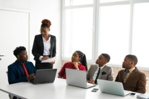 Team of young african people in the office at the table with a laptop _ Premium Photo
